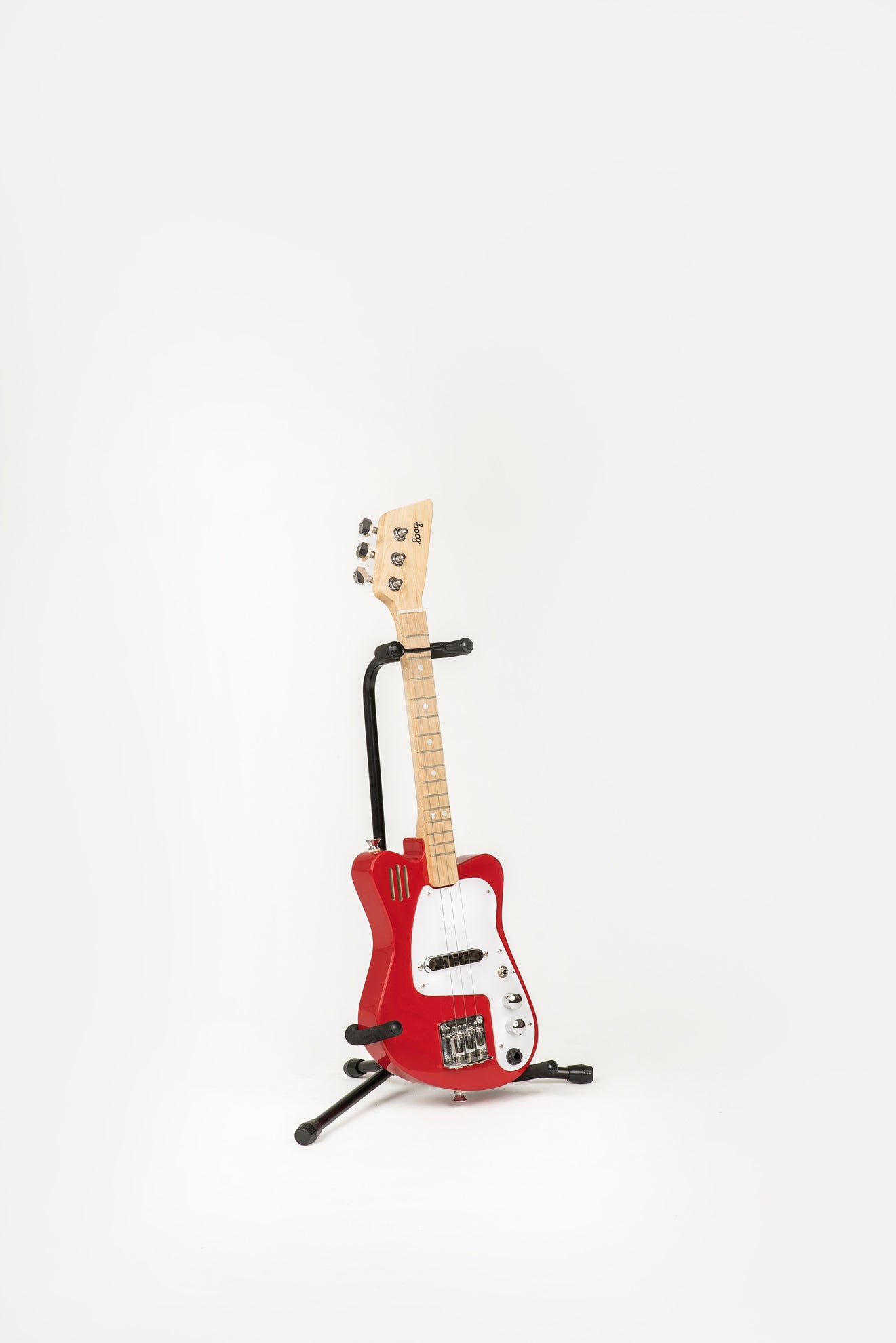 red mini guitar on loog stand